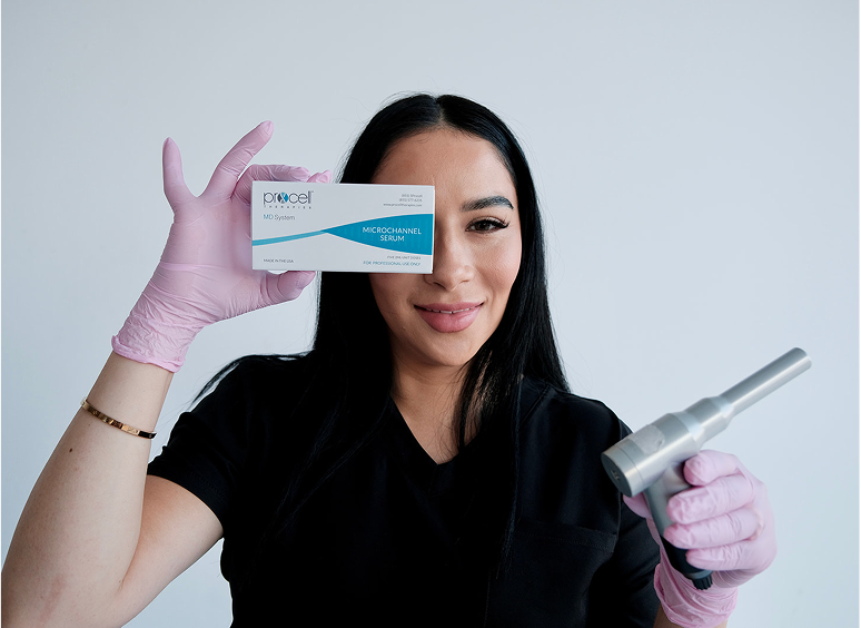 Woman wearing a dress and pink gloves, holding up a white card with text on it