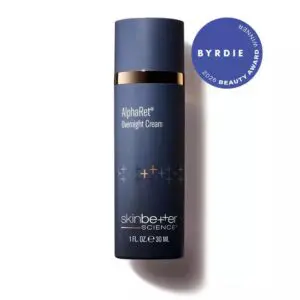 Bottle of ® Overnight Cream, with a blue label featuring the words "" in white lettering