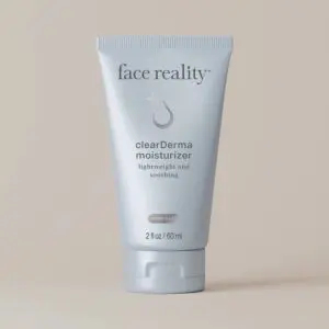 White background with a tube of face reality clearderma moisturizer, which is a light and soothing product
