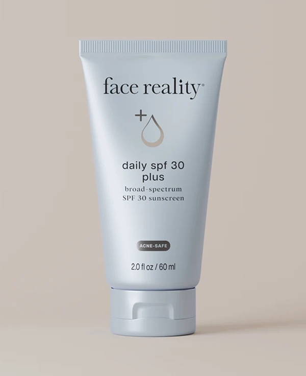 Cream tube of Face Reality Daily SPF 30 Plus Broad Spectrum SPF 50+ Sunscreen, with the words "Face Reality"