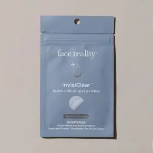 White background with a packet of face reality invisible clear hydrocelloid spot patches in the center