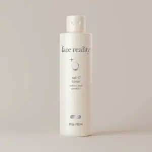 White bottle of face reality sal-c toner with a cap, set against a white background