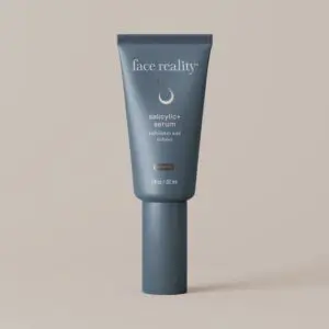 White background with a tube of face reality salicylic+ serum, which is a 30ml bottle