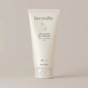 White background with a tube of face reality ultra gentle gel cleanser in the center